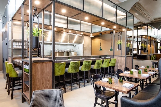 regina cleaning a restaurant with tables and chairs after regina cleaning